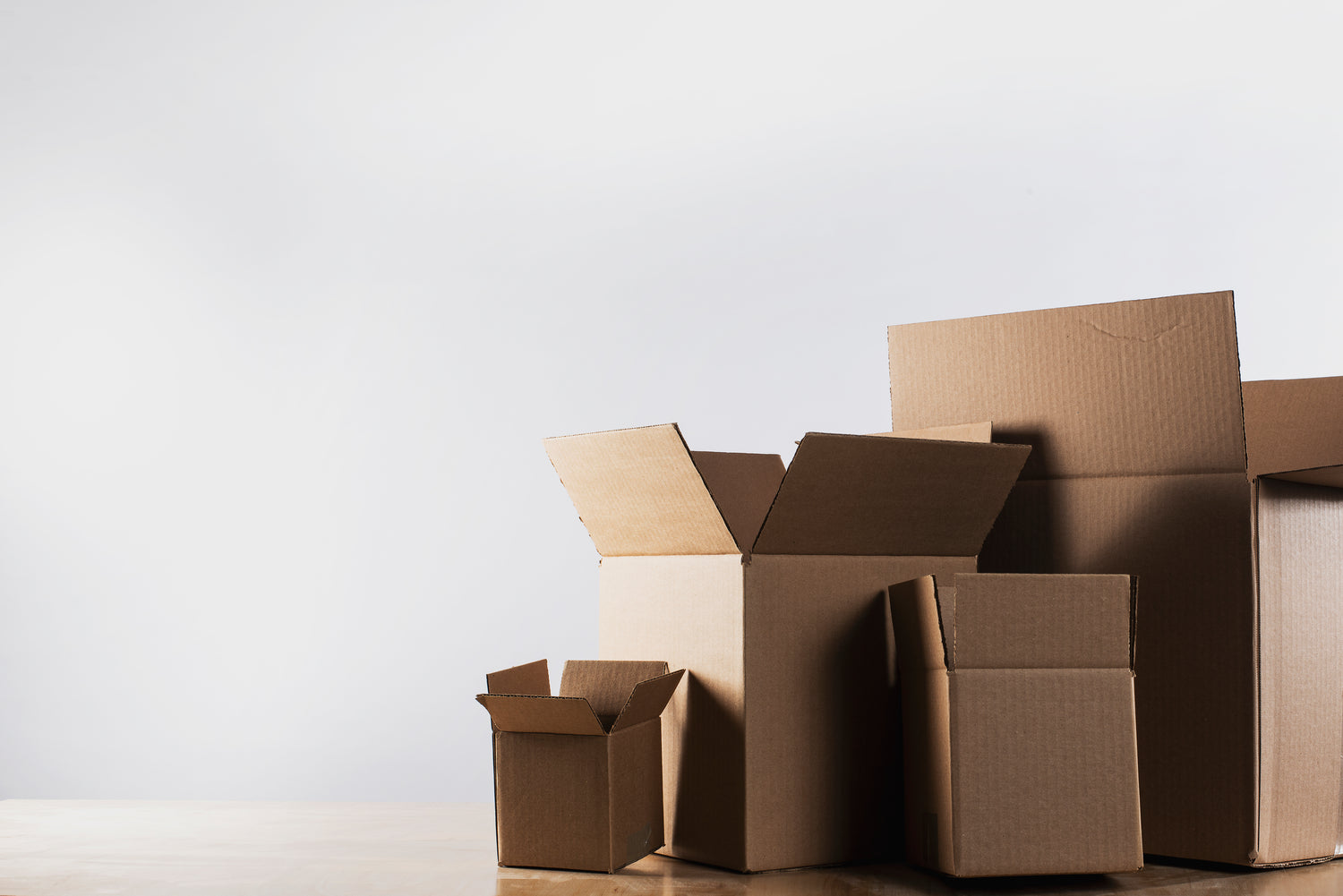empty brown cardboard boxes on a table