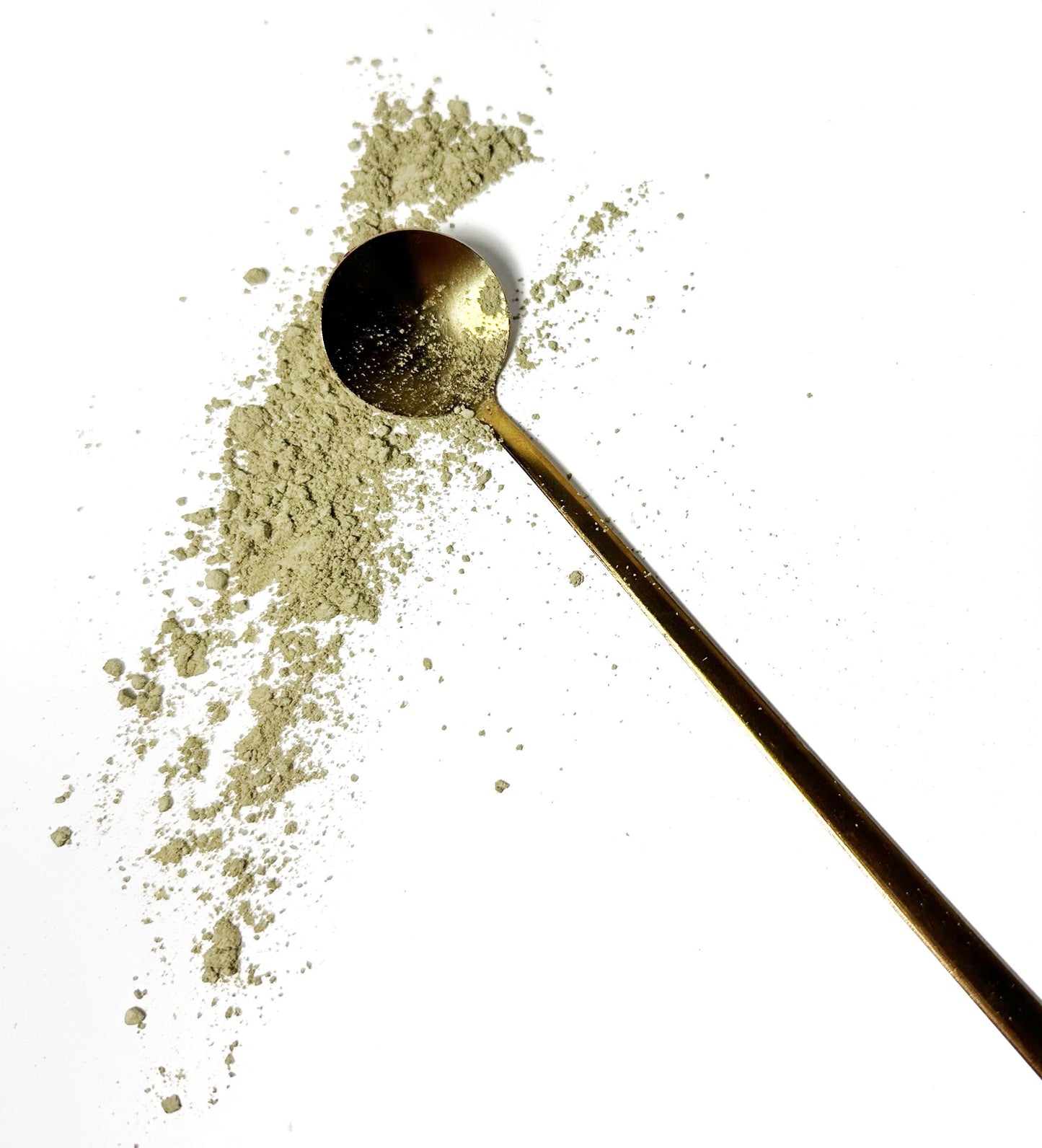 Adri Wellness's fine organic Neem powder scattered on a white surface with a golden spoon