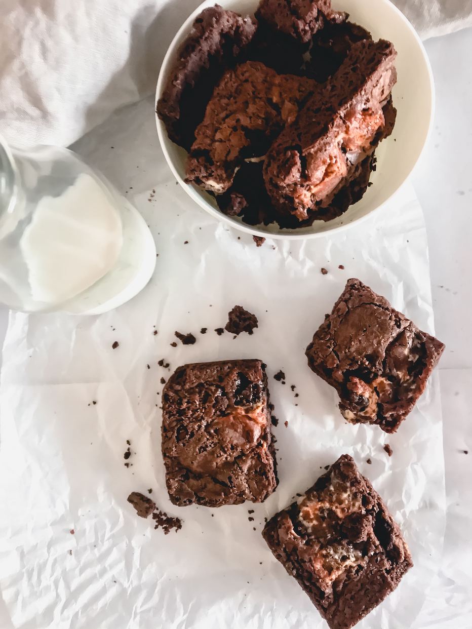 a batch of brownies made from Adri Wellness' stevia leaf powder placed on a white parchment paper and in a white bowl