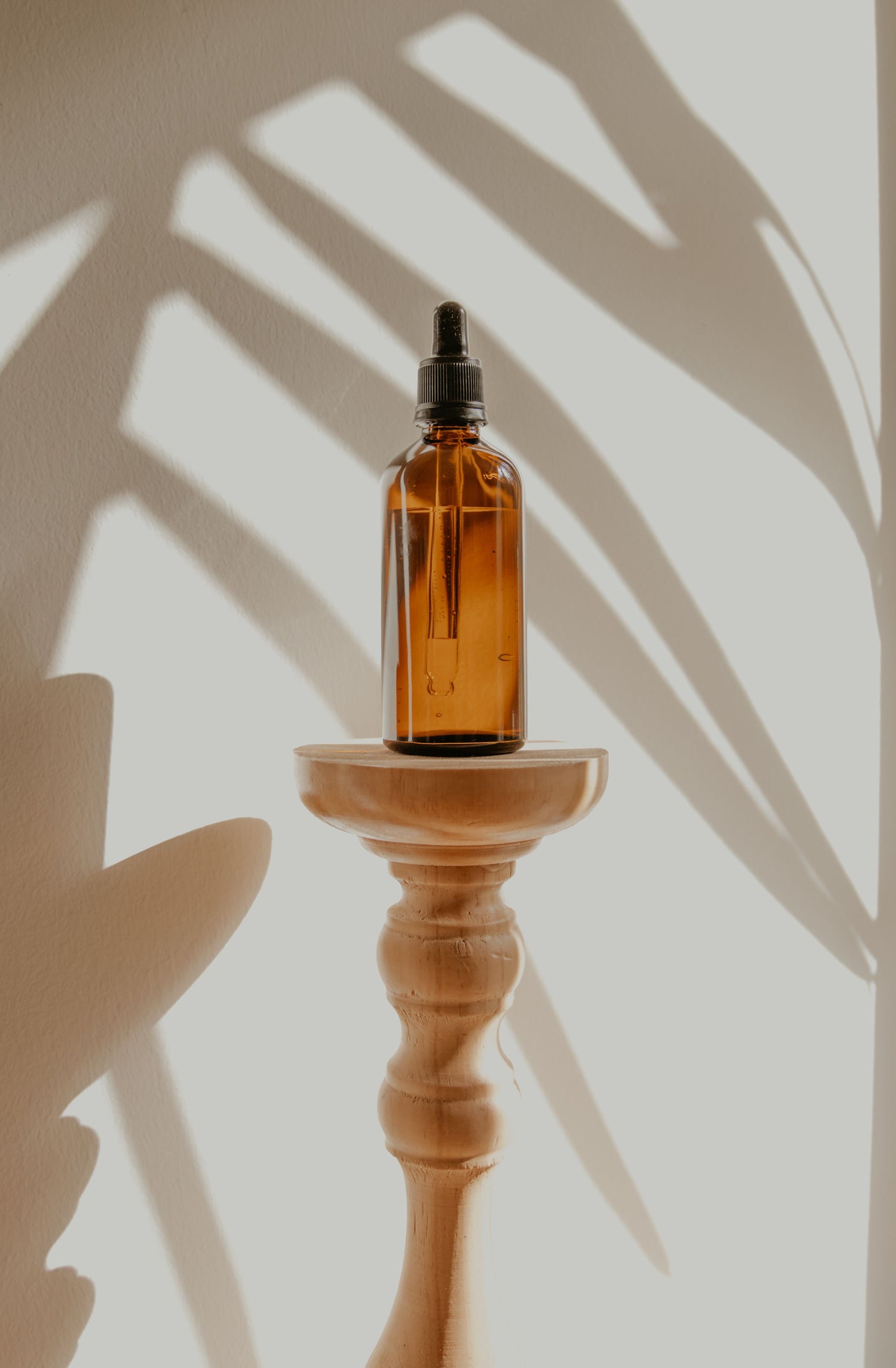 a dropper bottle containing Adri Wellness' Tulsi (Holy Basil) face oil